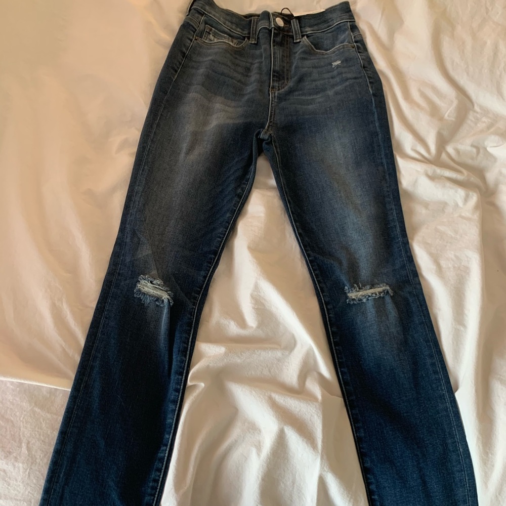Curvy high rise ripped knee skinny jean